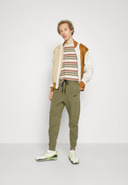 Calça Nike Tech Fleece Windrunner