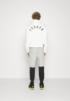 Calça Nike Tech Fleece Windrunner